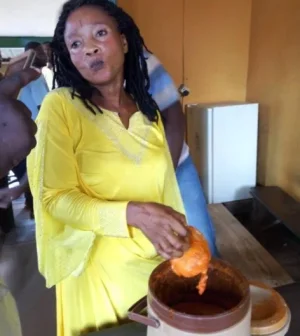 woman hides phone in soup.JPG