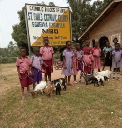 Photo Of Pupils Receiving Goats For Coming First In Their Respective Classes.jpg