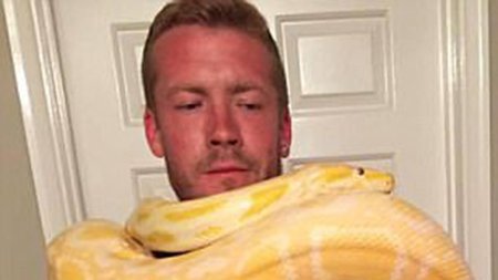 man-strangled by pet snake - RT News.jpg