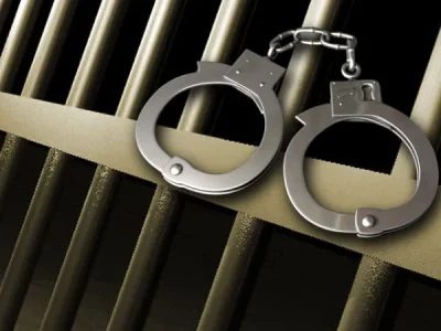Prison-bars-and-handcuffs.webp