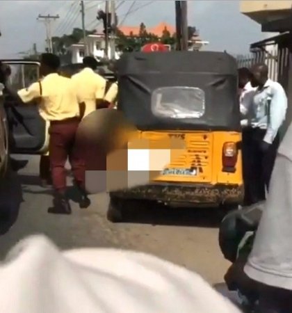 drama-as-man-strips-unclad-to-stop-lastma-officials-from-impounding-his-tricycle-in-lagos-photos.jpg