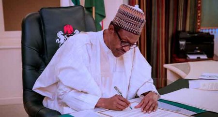 Buhari-signs-law.jpg