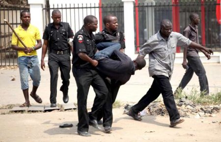 A-group-of-policeman-are-seen-manhandling-a-civilian.jpg