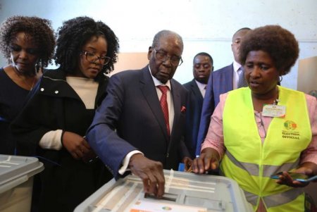 The-Guardian- Mugabe votes in first Zimbabwe election.jpg
