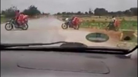 Tori Mill-bikers smuggling rice into Nigerian.jpg