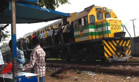 Passengers-hang-on-a-train-moving-through-Agbado-Ogun-State1.jpg