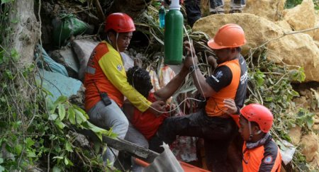Channels Television-Philippines-Landslide-Rescue workers.jpg