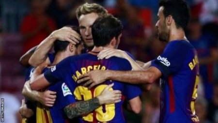 Barcelona players celebrate their victory.jpg