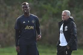 Paul Pogba and  Jose Mourinho.jpg