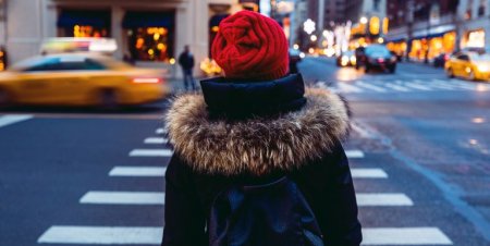 woman-waiting-to-cross-the-street-in-downtown-royalty-free-image-899360514-1548181944.jpg