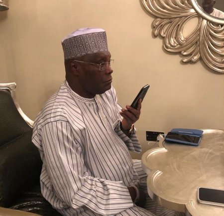 atiku on phone.jpg