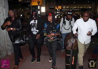 Wizkid and crew at Heathrow (1).JPG