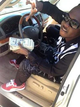 Waconzy flaunting $100,000.webp