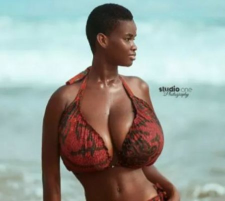 Meet the model who reportedly posses the biggest breasts in Ghana
