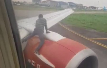 The man climbed an aircraft at the airport.jpg