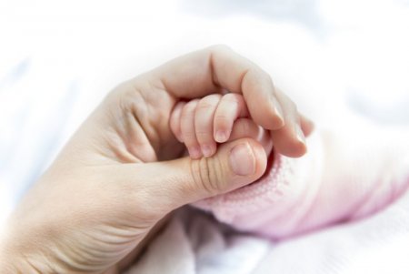 Mothers-hand-holding-newborn-babys-hand.jpg