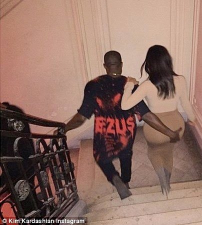 Kanye West grabbing Kim Kardashian's bum.jpg