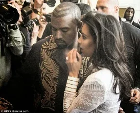 Kim Kardashian held by Kanye West.jpg