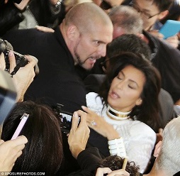 Kim Kardashian rescued by her bodyguard.jpg