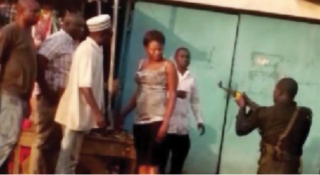 Police-corporal-threatening-to-shoot-a-woman-in-Lagos.jpg