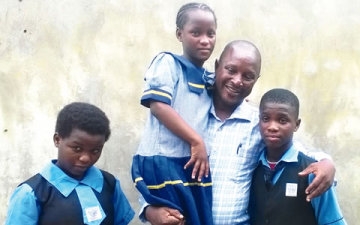 Adepegba-with-his-children-360x225.jpg
