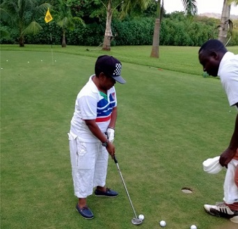 Osita Iheme playing golf.jpg