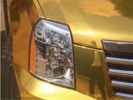 Kcee 2014 gold coloured Cadillac Escalade.JPG