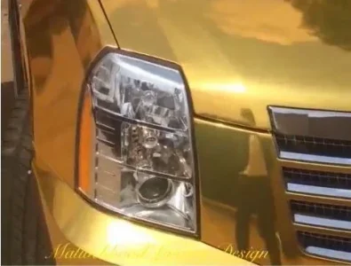 Kcee 2014 gold coloured Cadillac Escalade.webp