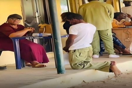 Outrage as NYSC Member Kneels Before Official in Viral Photo