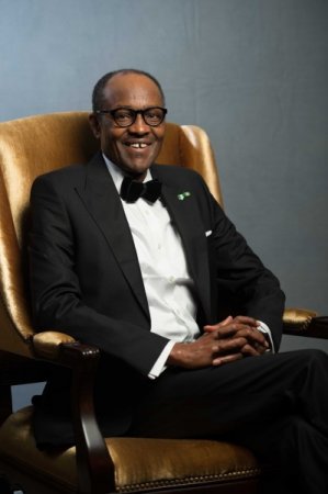 buhari smiling seated.jpg