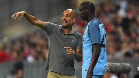 yaya toure and guardiola.jpg