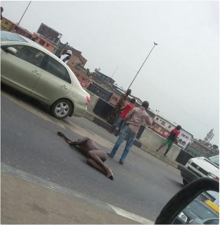 Photos Man Lies Naked On Lagos Road Report Naija