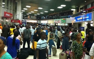passengers at airport.webp