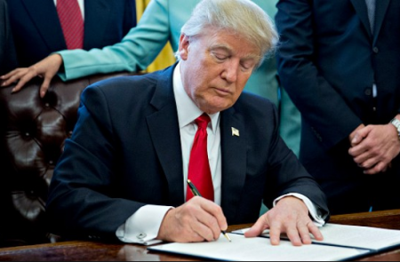 trump signing executive order.PNG