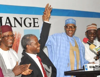buhari-holding-osinbajo-hand.webp