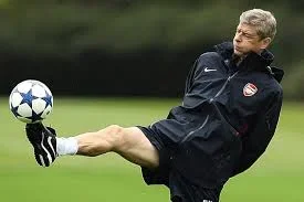 wenger plays ball.jpg