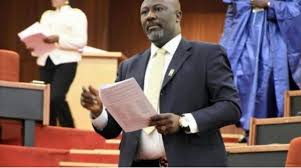 melaye holding paper.jpg