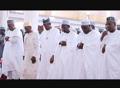 saraki and Buhari praying.JPG